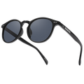 Black sunglasses with round dark lenses and NAKED text on the temple, viewed at an angle. These stylish The WHOOP by NAKED Optics feature polarisierte Sonnenbrille Gläser and provide reliable UV400 Schutz for your eyes.