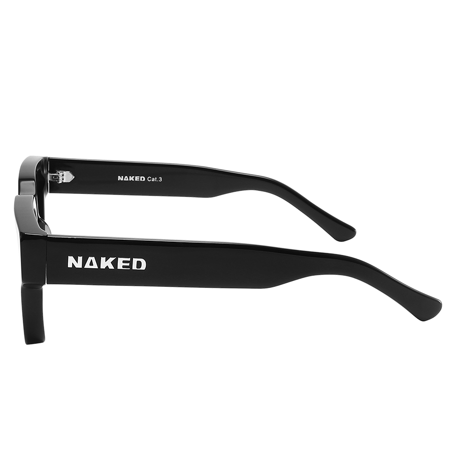 Black eyeglass frames from NAKED Optics, called The AURA, featuring a retro design and “NAKED” written in white on the side, displayed on a white background.