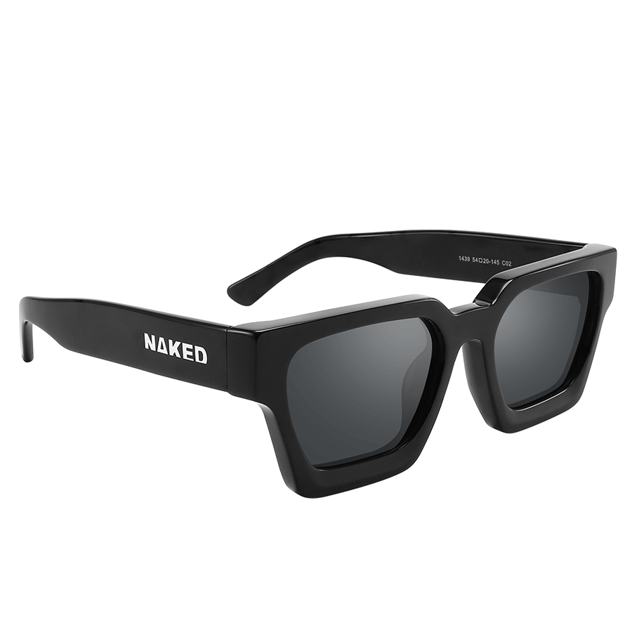 The AURA by NAKED Optics is a black rectangular pair of sunglasses with thick frames and “NAKED” written in white on the left temple, featuring a stylish retro design for a timeless look.