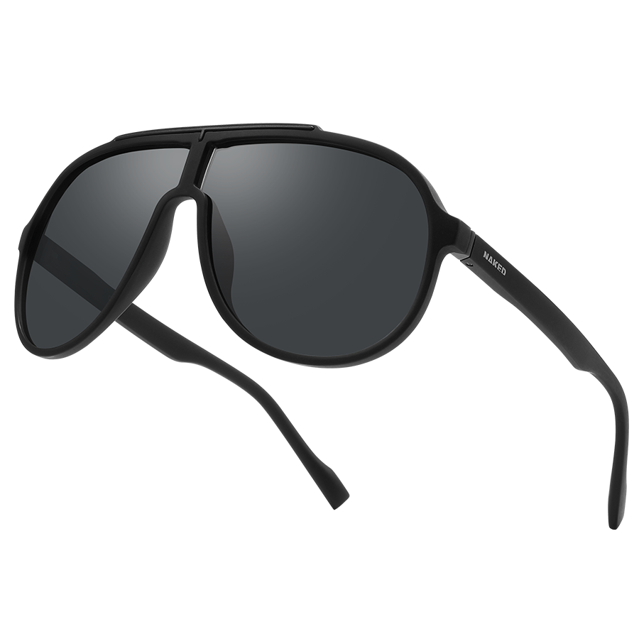 The PILOT by NAKED Optics is a black aviator-style sunglasses with an oversized design and dark UV400 lenses, displayed on a white background.