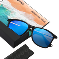The ACE by NAKED Optics are black sunglasses featuring blue mirrored, polarized lenses for optimal UV protection, shown alongside a cleaning cloth and a box with a beach image and branding.