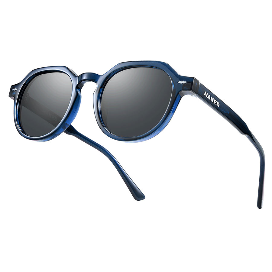The LUNA by NAKED Optics, featuring a blue frame and round dark polarized lenses, is shown at an angle on a white background.
