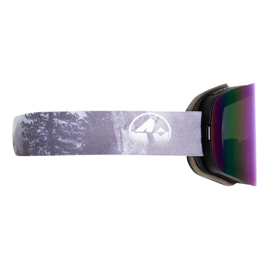 Seitenansicht der Skibrille „The TROOP Bike“ von NAKED Optics mit einem violetten Riemen mit Berg-Logo und Baummotiv; kompatibel mit Wechselgläsern für vielseitigen Einsatz.