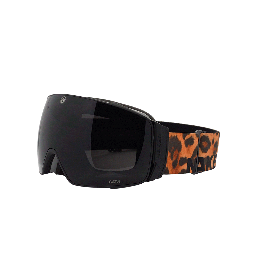 The STORM by NAKED Optics are black ski goggles featuring a wide, sphärische Skibrille lens and an orange leopard-print strap. Designed with Anti-Fog-Beschichtung for clear vision on the slopes, these goggles also include a convenient Magnetwechselsystem for easy lens changes.