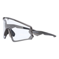The FALCON by NAKED Optics is a gray sportbrille with clear lenses and a geometric frame, featuring UV400 Schutz, shown from the side on a white background.