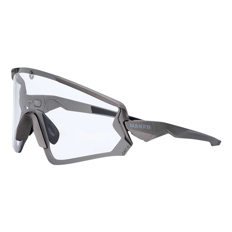 The FALCON by NAKED Optics is a gray sportbrille with clear lenses and a geometric frame, featuring UV400 Schutz, shown from the side on a white background.