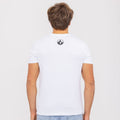 A person facing away, wearing the NAKED Optics T-Shirt Bicolor-Logo in white, made from bio-cotton and featuring a small black NAKED Optics logo on the upper back.