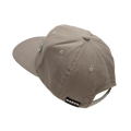 A light brown Cap Snapback by NAKED Optics, featuring eyelets, stitching detail, and a branded label above the adjustable strap.