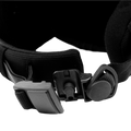 Close-up of a black magnetic goggle strap buckle on The APEX ski helmet.