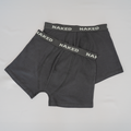 Two pairs of black Boxershorts - 2 Pack by NAKED Optics, featuring the brand name on the elastic waistbands and displayed flat on a white surface. Diese Boxershorts aus Baumwolle bieten hervorragenden Tragekomfort und sind als atmungsaktive Unterwäsche ideal für den Alltag.