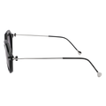 Side view of The IZZY by NAKED Optics, a black rectangular Sonnenbrille with an Acetat Rahmen, thin silver arms, clear nose pads, and full UV400-Schutz displayed on a white background.