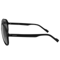 The PILOT sunglasses by NAKED Optics in black, featuring an oversized design and dark UV400 lenses, are shown in profile against a white background.