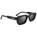 The IRIS by NAKED Optics is a black rectangular Sonnenbrille with thick frames, dark polarisierte Gläser, UV400-Schutz, and NAKED written on the temple.