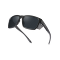 Black sunglasses with thick frames and dark lenses, positioned on a white background—The ASCENT by NAKED Optics offer reliable UV400 protection, making them perfect for alpine adventures.