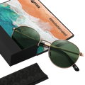 The PARKER round sunglasses by NAKED Optics feature green lenses and a sleek metal frame, elegantly displayed on a case with a beach-themed cloth labeled #lifeisbetternaked. Combining stylish design with practicality, these Metallrahmen Sonnenbrille offer UV400 Schutz—making them the ideal choice for all your sunny adventures.