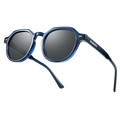 The LUNA by NAKED Optics, featuring a blue frame and round dark polarized lenses, is shown at an angle on a white background.