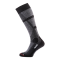 A single knee-high gray and black NAKED Optics Skisocken Merino featuring geometric patterns is displayed against a plain white background. Ideal for both Damen und Herren, these Skisocken offer stylish looks combined with exceptional comfort.